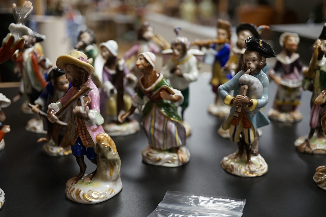A group of twenty German porcelain monkey band figures, largest 15.5cm high